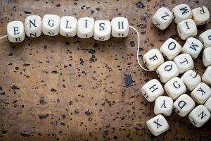 english-text-on-a-wooden-cubes-strung-on-a-thread-picture-id637773730